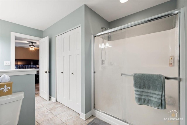 1308 Burry St, Joliet, IL 60435 - full bath with a stall shower, tile patterned floors, toilet, and ceiling fan