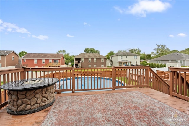 1308 Burry St, Joliet, IL 60435 - wooden terrace with a residential view and an outdoor fire pit