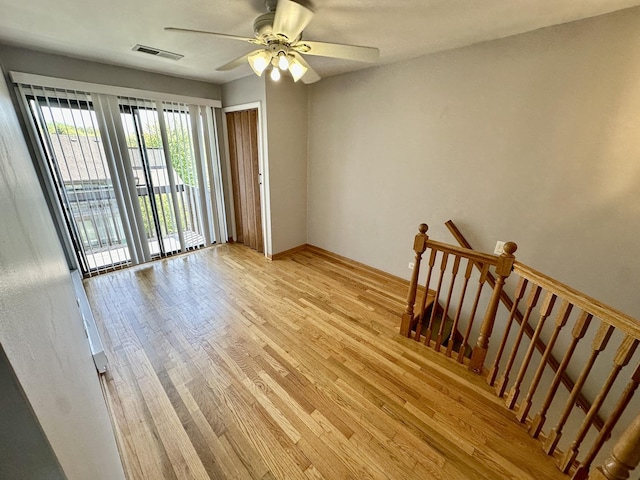 35 Montego Colony Unit 1, Fox Lake, IL 60020 - spare room with light wood-type flooring, a ceiling fan, and baseboards