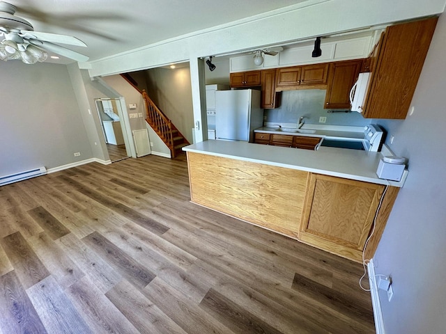 35 Montego Colony Unit 1, Fox Lake, IL 60020 - kitchen with freestanding refrigerator, white microwave, stove, a ceiling fan, and light countertops