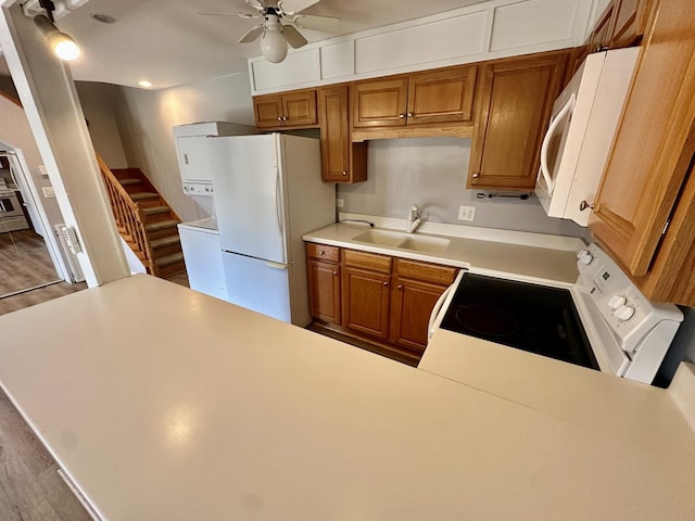 35 Montego Colony Unit 1, Fox Lake, IL 60020 - kitchen with white appliances, a sink, a ceiling fan, light countertops, and a peninsula