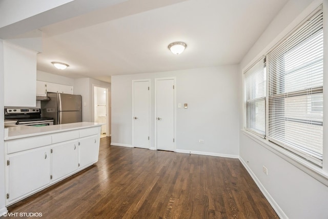 5747 S Kenton Ave Unit 3S, Chicago, IL 60629 - kitchen featuring appliances with stainless steel finishes, dark wood-type flooring, baseboards, and white cabinets