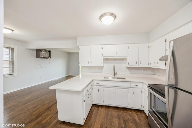 5747 S Kenton Ave Unit 3S, Chicago, IL 60629 - kitchen featuring a sink, appliances with stainless steel finishes, a peninsula, dark wood-style flooring, and light countertops