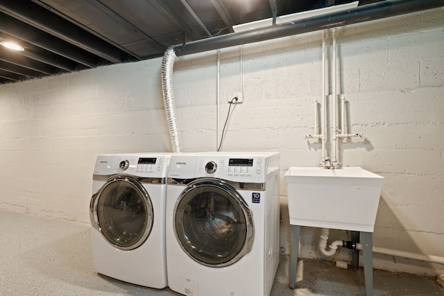 715 E 105th Pl, Chicago, IL 60628 - laundry area with washer and clothes dryer and concrete block wall