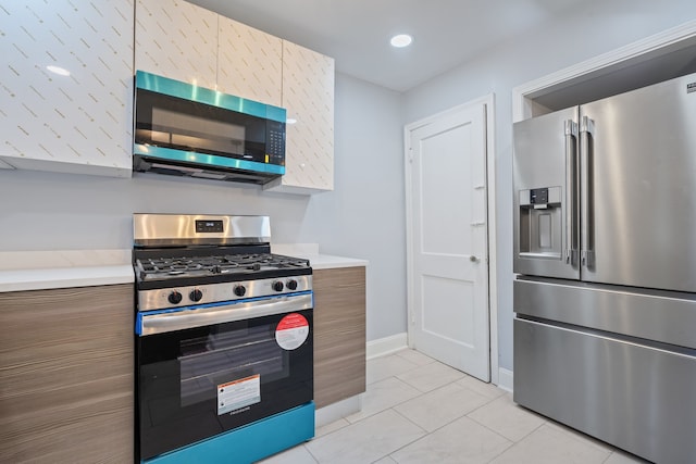 715 E 105th Pl, Chicago, IL 60628 - kitchen featuring appliances with stainless steel finishes, modern cabinets, light countertops, and brown cabinets