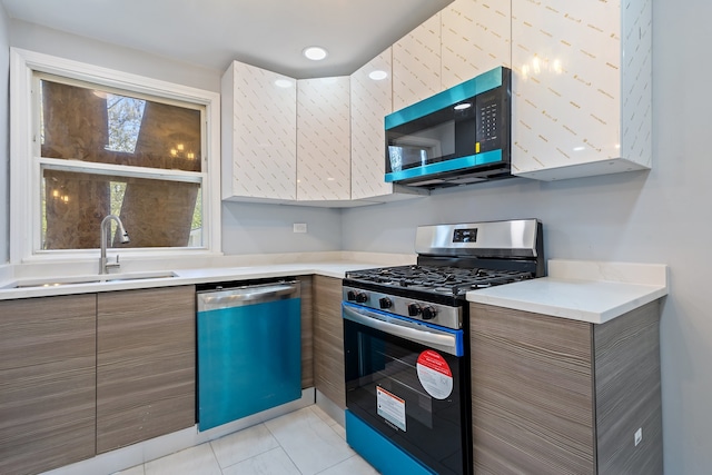 715 E 105th Pl, Chicago, IL 60628 - kitchen with stainless steel gas range oven, dishwashing machine, modern cabinets, a sink, and brown cabinets