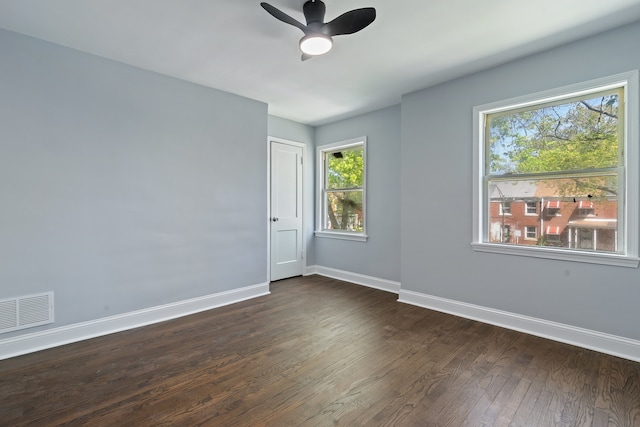 715 E 105th Pl, Chicago, IL 60628 - unfurnished room with baseboards, dark wood finished floors, and a ceiling fan