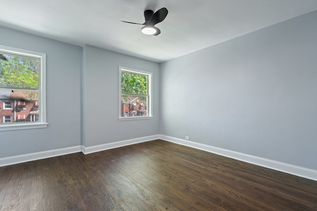 715 E 105th Pl, Chicago, IL 60628 - unfurnished room with plenty of natural light, dark wood finished floors, ceiling fan, and baseboards