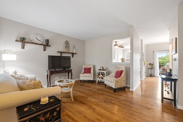 9051 Mansfield Dr, Tinley Park, IL 60487 - living area featuring wood finished floors, baseboards, and a ceiling fan