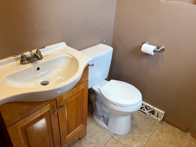 9865 Garden Ct, Schiller Park, IL 60176 - bathroom featuring toilet, vanity, tile patterned floors, and baseboards