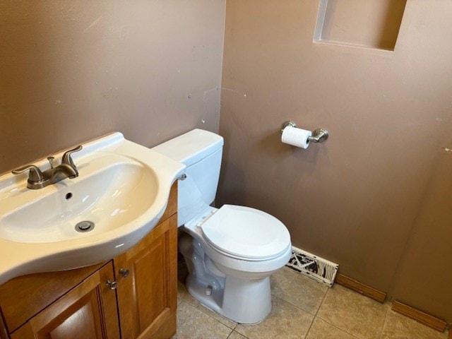 9865 Garden Ct, Schiller Park, IL 60176 - bathroom with toilet, vanity, and tile patterned flooring
