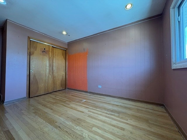 9865 Garden Ct, Schiller Park, IL 60176 - unfurnished bedroom featuring wood finished floors, multiple windows, recessed lighting, baseboards, and a closet
