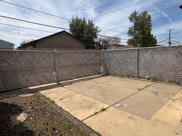 9865 Garden Ct, Schiller Park, IL 60176 - view of patio / terrace with a gate and fence