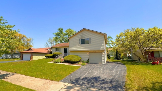 tri-level home featuring a front lawn, driveway, and a garage