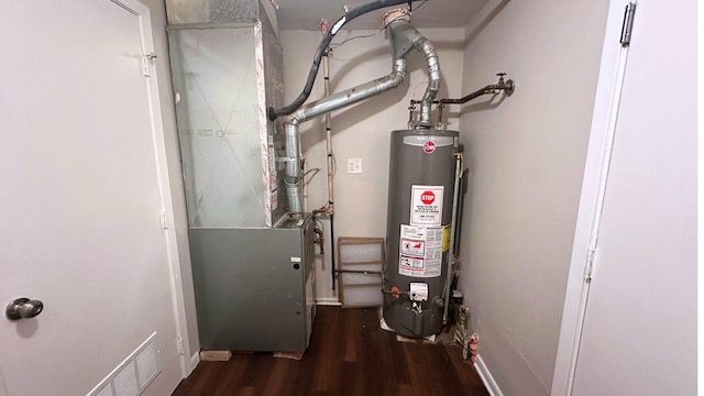 utility room featuring water heater