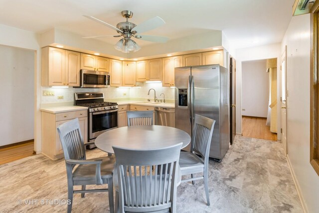 1527 W Amelia Ln, Addison, IL 60101 - kitchen with appliances with stainless steel finishes, light brown cabinetry, a sink, baseboards, and ceiling fan