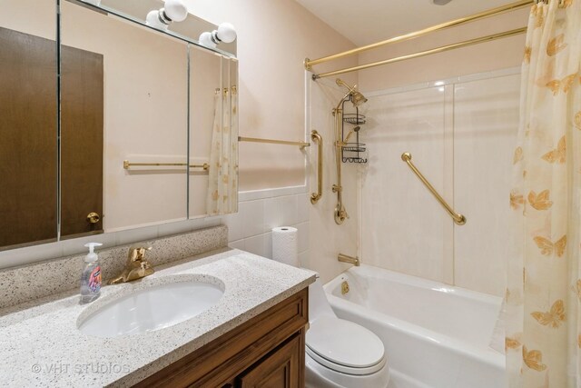 1527 W Amelia Ln, Addison, IL 60101 - bathroom with shower / bath combination with curtain, vanity, toilet, a wainscoted wall, and tile walls