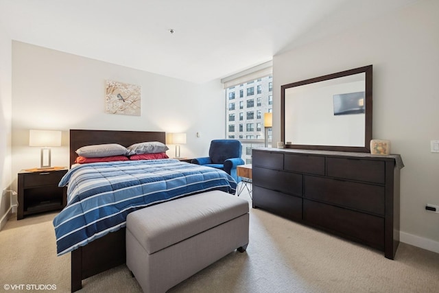 250 E Pearson St Unit 1306, Chicago, IL 60611 - bedroom with baseboards and light carpet