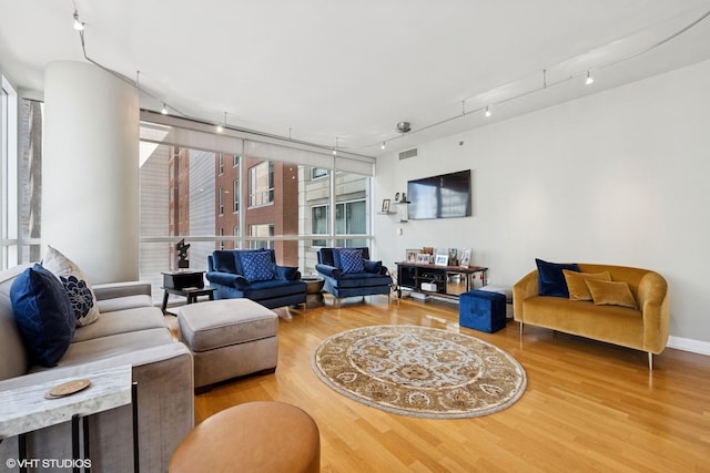 250 E Pearson St Unit 1306, Chicago, IL 60611 - living room featuring wood finished floors and track lighting