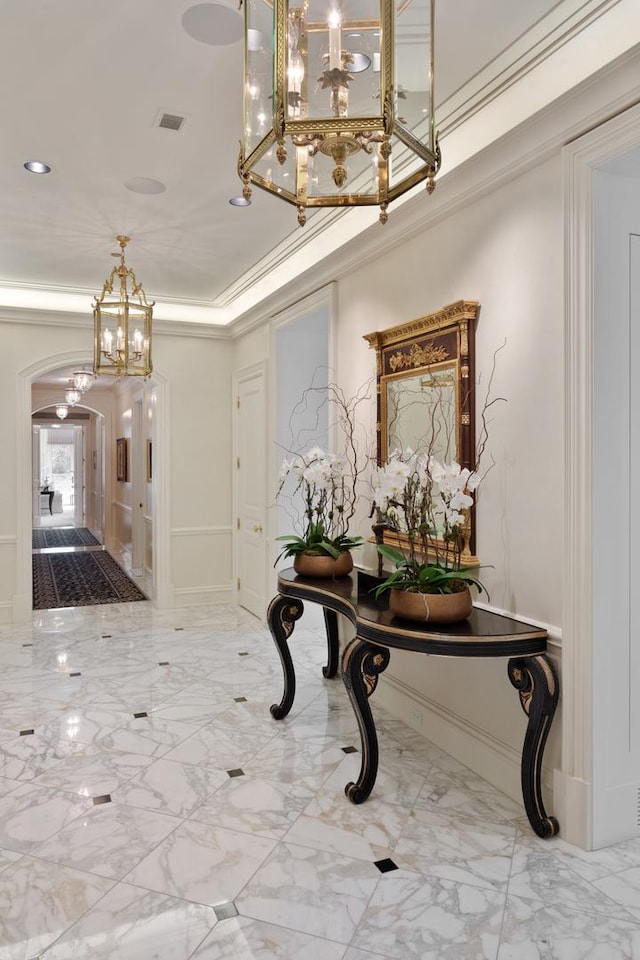 65 E Goethe St Unit 4N, Chicago, IL 60610 - foyer with a chandelier, arched walkways, marble finish floors, ornamental molding, and french doors