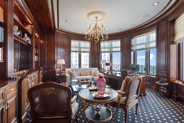 65 E Goethe St Unit 4N, Chicago, IL 60610 - living area featuring crown molding, a chandelier, dark carpet, a decorative wall, and wood walls