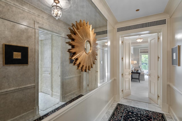 65 E Goethe St Unit 4N, Chicago, IL 60610 - hall featuring ornamental molding, light marble finish floors, and a decorative wall