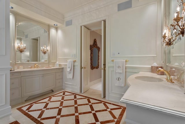 65 E Goethe St Unit 4N, Chicago, IL 60610 - full bath with a decorative wall, inlaid floor details, a chandelier, crown molding, and vanity