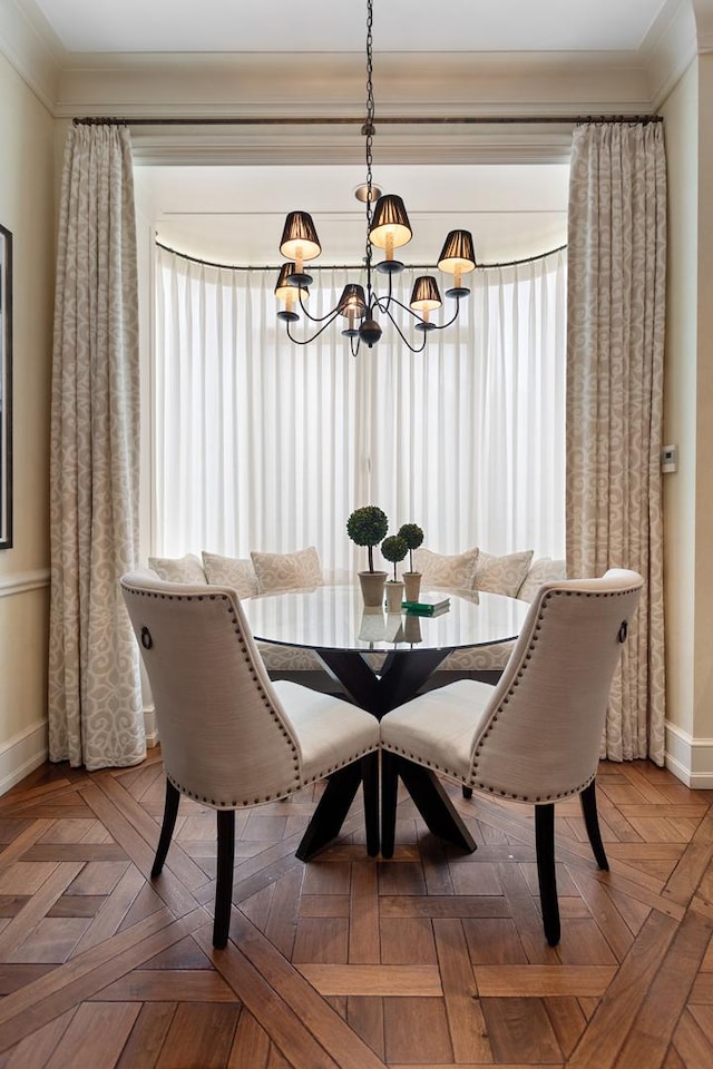 65 E Goethe St Unit 4N, Chicago, IL 60610 - dining area with a chandelier, baseboards, and crown molding