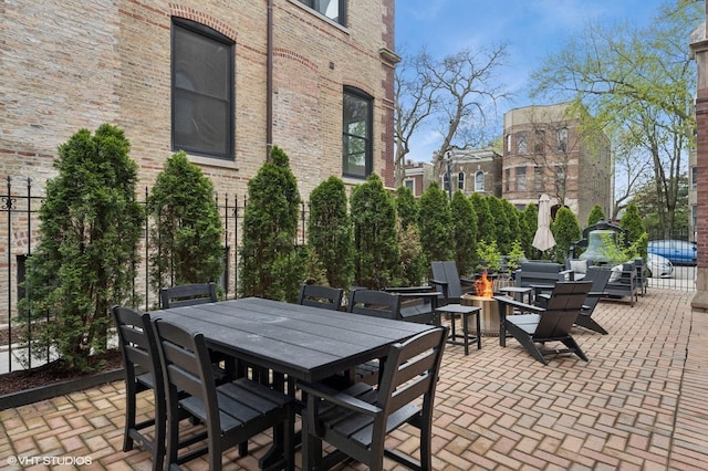 921 N Hoyne Ave Unit 1, Chicago, IL 60622 - view of patio with an outdoor fire pit and outdoor dining area