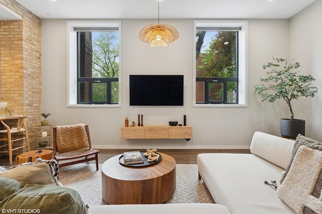 921 N Hoyne Ave Unit 1, Chicago, IL 60622 - living room featuring plenty of natural light, wood finished floors, and baseboards