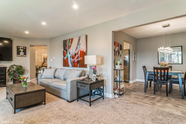 100 Lake Blvd Unit 646, Buffalo Grove, IL 60089 - carpeted living area with baseboards, recessed lighting, a chandelier, and wood finished floors