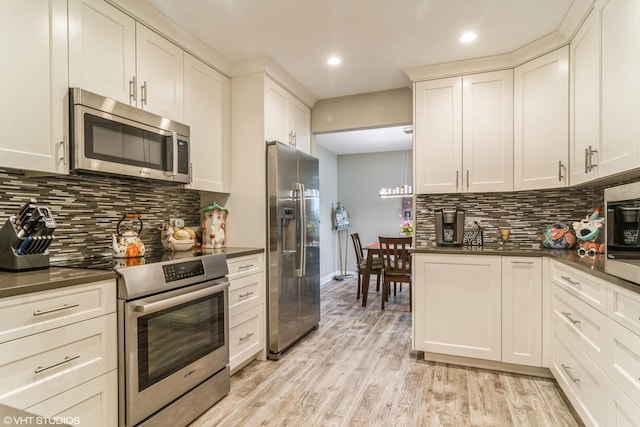 100 Lake Blvd Unit 646, Buffalo Grove, IL 60089 - kitchen featuring stainless steel appliances, dark countertops, tasteful backsplash, and recessed lighting