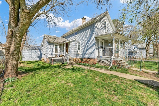 401 S Maple St, Urbana, IL 61801 - view of property exterior featuring a chimney and covered porch