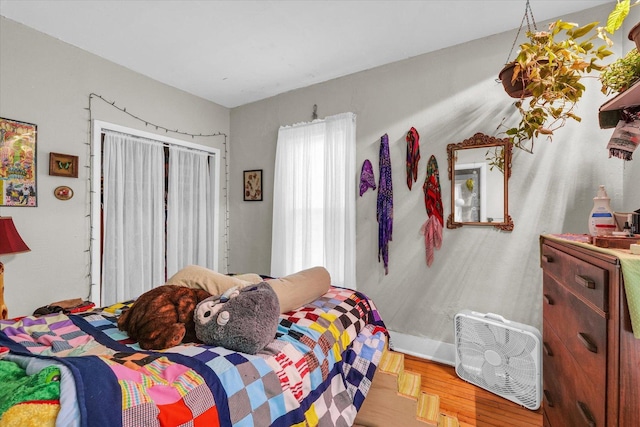 401 S Maple St, Urbana, IL 61801 - bedroom featuring wood finished floors and a closet