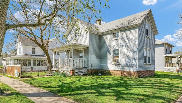 401 S Maple St, Urbana, IL 61801 - view of front of property featuring covered porch, a front yard, and a chimney