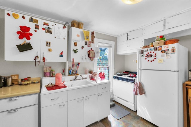 401 S Maple St, Urbana, IL 61801 - kitchen with white appliances, light countertops, white cabinetry, and a sink