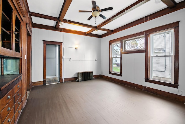 152 S Greenwood Ave, Kankakee, IL 60901 - unfurnished living room featuring radiator heating unit, baseboards, coffered ceiling, dark wood finished floors, and beam ceiling