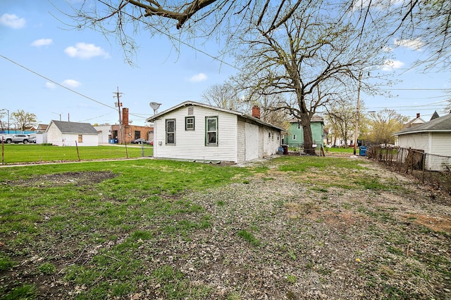 152 S Greenwood Ave, Kankakee, IL 60901 - rear view of house featuring a chimney