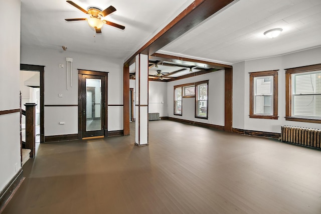 152 S Greenwood Ave, Kankakee, IL 60901 - empty room featuring a ceiling fan, radiator heating unit, baseboards, wood finished floors, and beamed ceiling