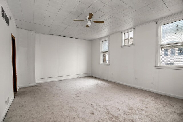 152 S Greenwood Ave, Kankakee, IL 60901 - unfurnished room with carpet, a ceiling fan, and baseboards