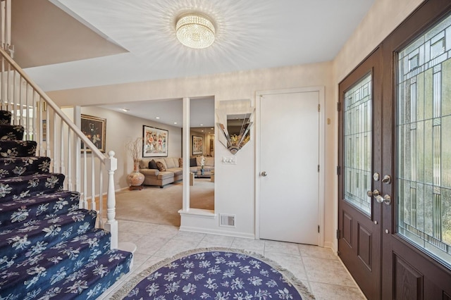 1251 Country Ln, Deerfield, IL 60015 - tiled foyer featuring a chandelier, carpet flooring, french doors, stairs, and baseboards