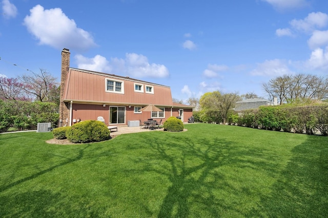 1251 Country Ln, Deerfield, IL 60015 - rear view of property with a chimney, a patio, a lawn, and central air condition unit