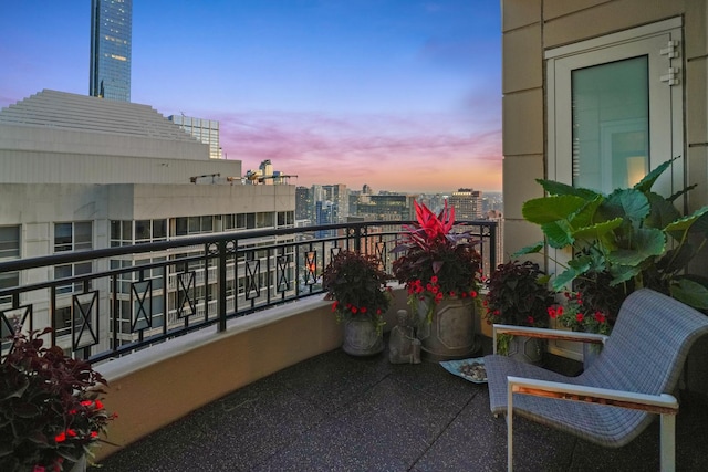 balcony at dusk with a city view