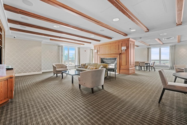 lobby with wallpapered walls and beam ceiling