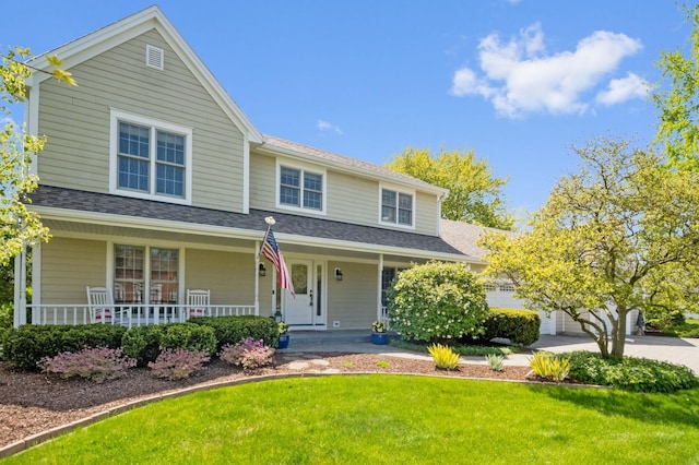 1527 Steeplechase Ct, Green Oaks, IL 60048 - traditional home with a porch, a front yard, a garage, and concrete driveway