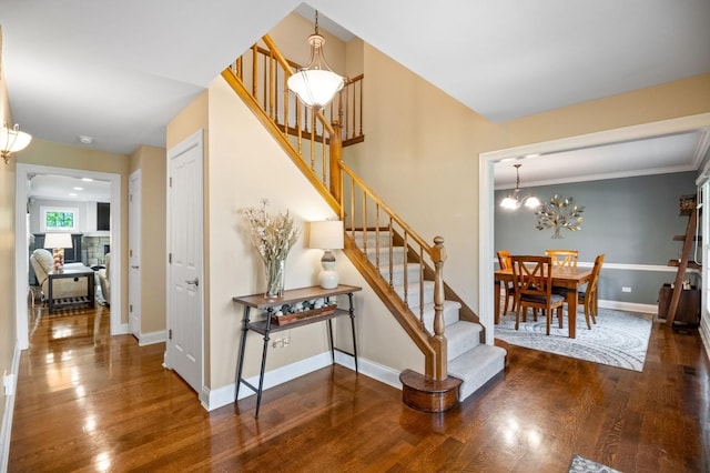 1527 Steeplechase Ct, Green Oaks, IL 60048 - stairs with wood finished floors, baseboards, a chandelier, and crown molding