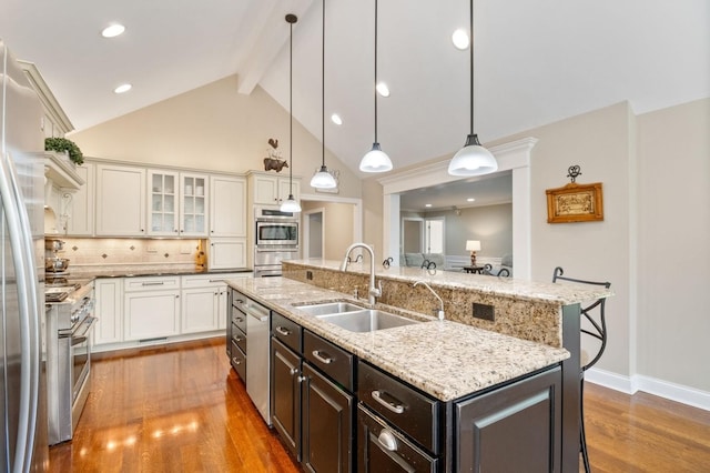 1527 Steeplechase Ct, Green Oaks, IL 60048 - kitchen featuring a sink, appliances with stainless steel finishes, beam ceiling, wood finished floors, and a kitchen island with sink