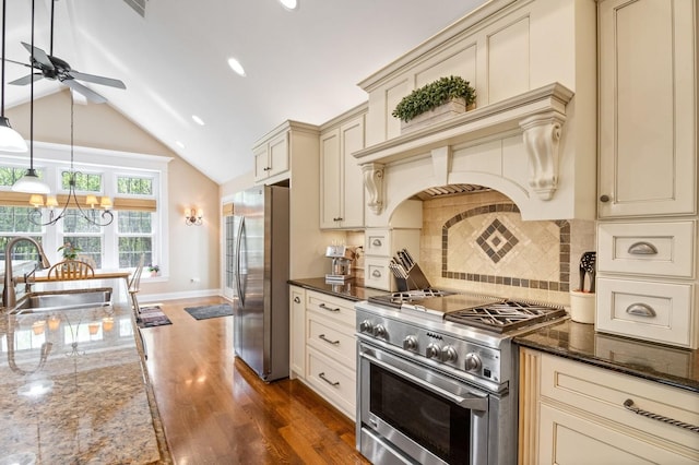 1527 Steeplechase Ct, Green Oaks, IL 60048 - kitchen with cream cabinets, stainless steel appliances, a sink, ceiling fan, and vaulted ceiling