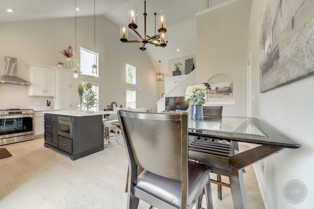 570 Sudbury Cir, Oswego, IL 60543 - dining area with high vaulted ceiling, a chandelier, and recessed lighting