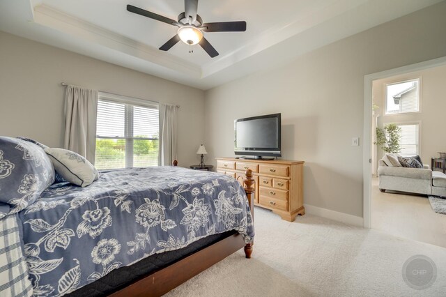 570 Sudbury Cir, Oswego, IL 60543 - bedroom with carpet floors, a raised ceiling, ornamental molding, baseboards, and ceiling fan